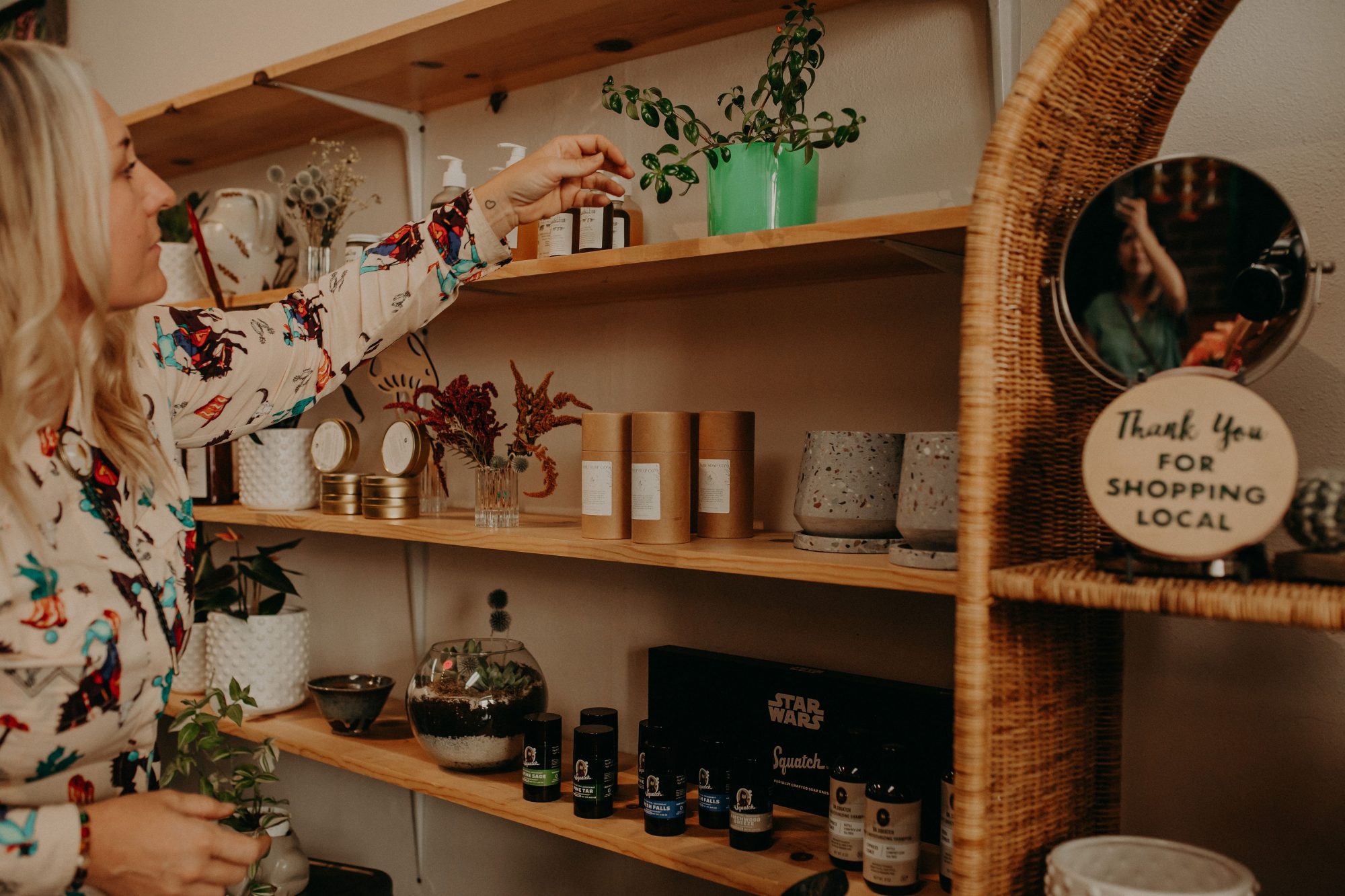 floral shop owner organizing a designed shelf